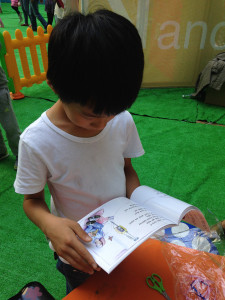 Boy reading our book